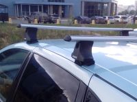 Багажник на крышу Nissan Tino (без рейлингов), Атлант, аэродинамические дуги