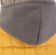 Басик в желтой жилетке с серым капюшоном