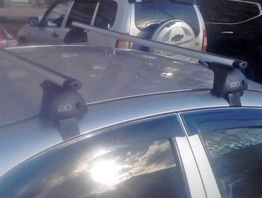 Багажник на крышу Chevrolet Aveo 2002-11 sedan/hatchback, Евродеталь, аэродинамические дуги