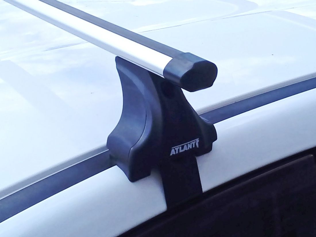 Багажник на крышу Kia K5 2020-..., Атлант, аэродинамические дуги Эконом, опора Е